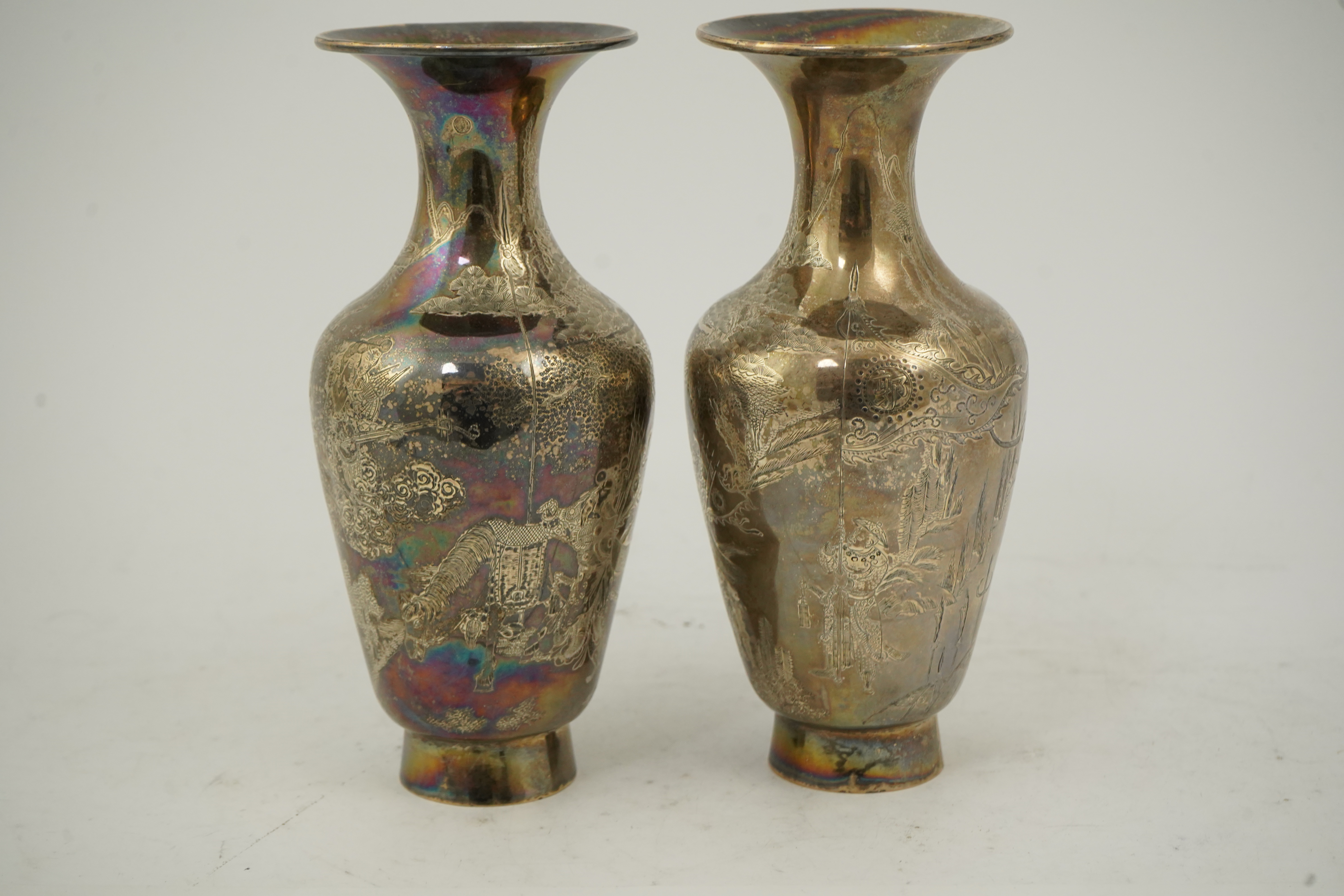 A pair of Chinese silver ‘immortals’ vases, late 19th century